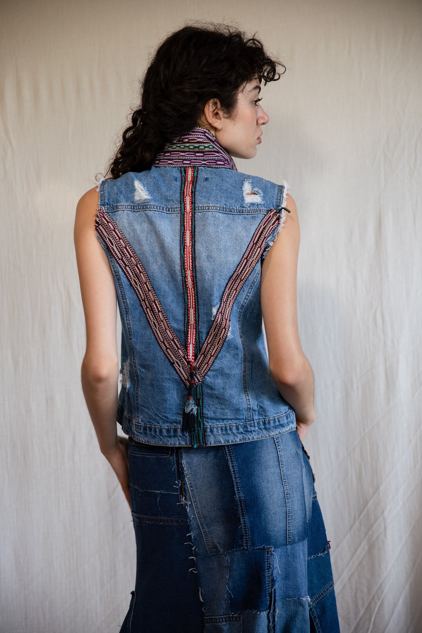 B.07 Denim vest with colorful trims and tassels