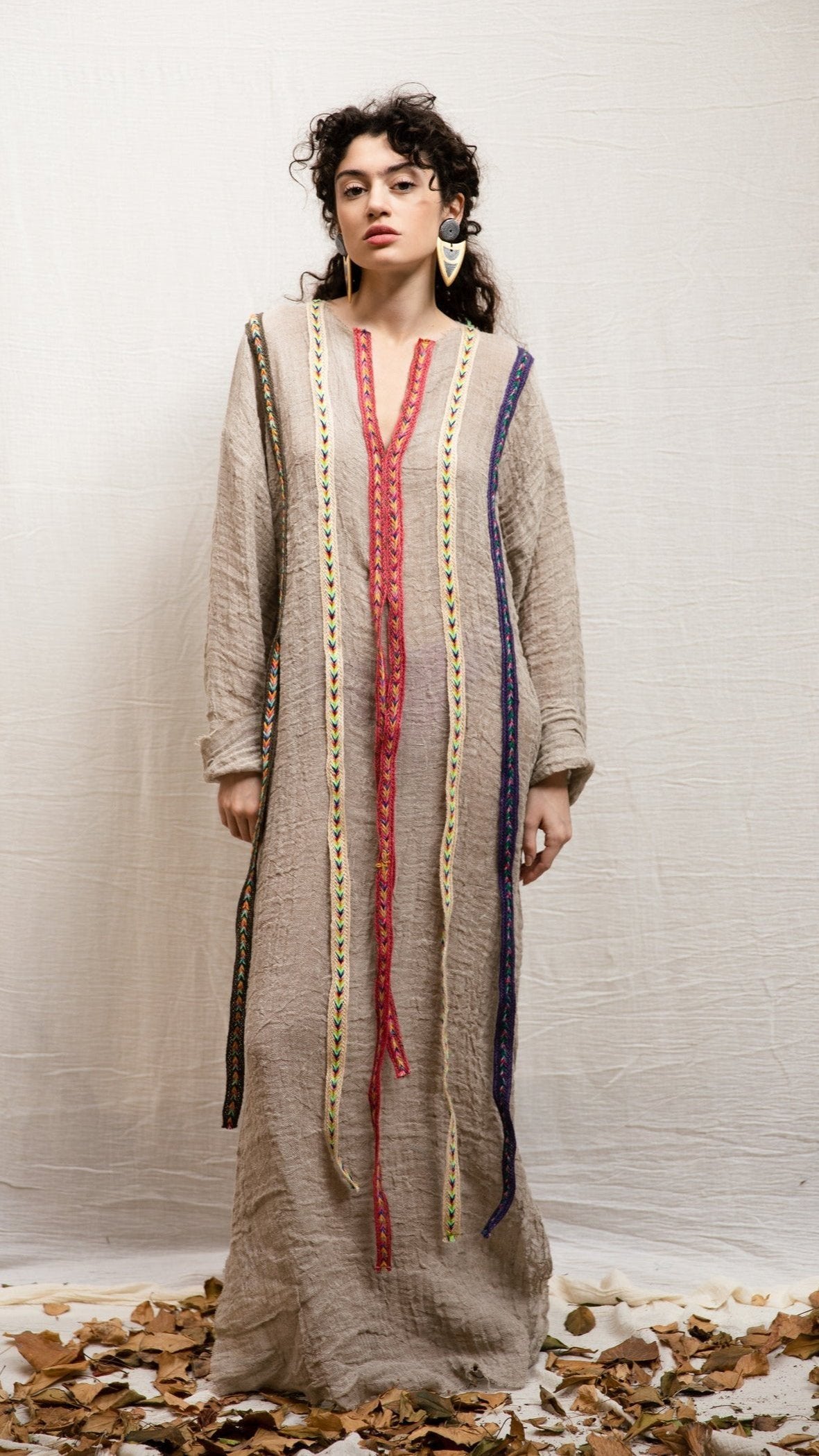 D.393 Natural beige V-neck caftan dress with colorful trims.