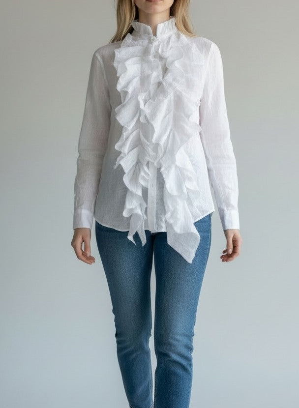 Person wearing a white ruffled shirt